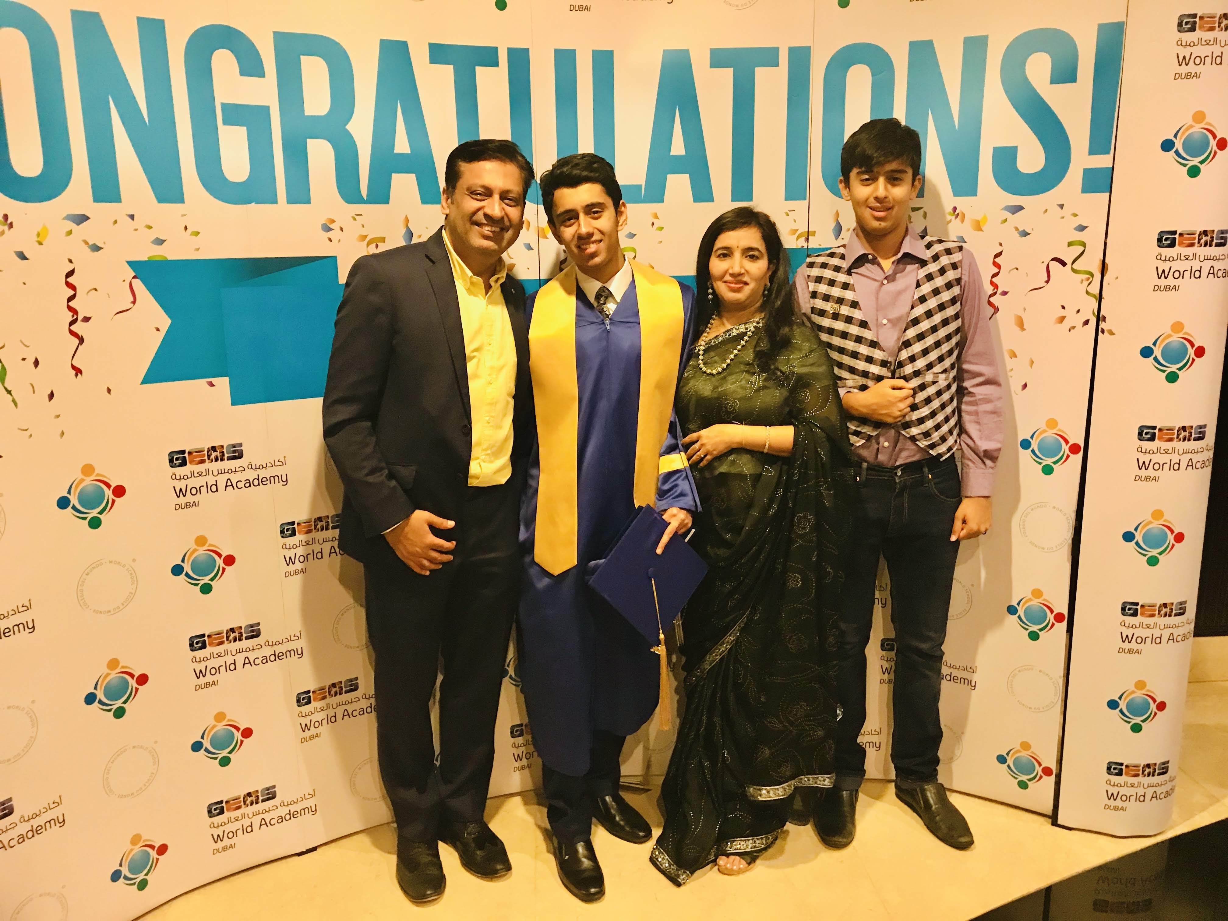Avik and Ishir with their parents at Avik's graduation